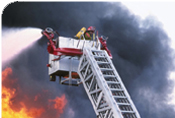 Firemen on ladder estinguishing a fire